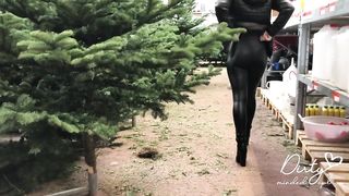 Amateur Girl with Latex Leggings Searching for a Perfect Christmas Tree