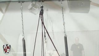Ass hooked Brunette in bondage device on treadmill