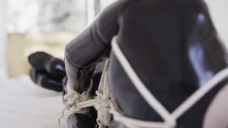 Bondage in a Latex Black Catsuit