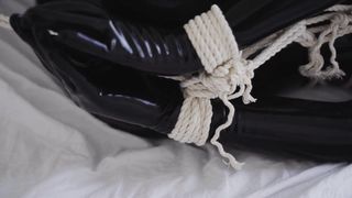 Bondage in a Latex Black Catsuit