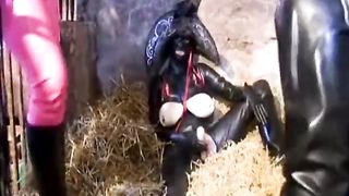 The Encasement Rubber Slave is Dominated by two Latex Mistresses in an old Shed - Part 2