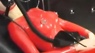 Hot Girl Full Encased in Red Rubber Suit Enjoys Gas Mask Breathplay in her Black Room