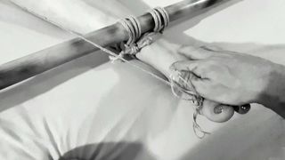 Tits bondage with her NIPPLES clamped to her TOES