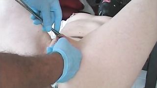 Slave's pussy getting pierced