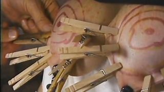 Chubby whore with paper bag on head has her jugs and cunt