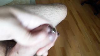 Close up for full insertion of 9 '' sounding rod into urethral peehole