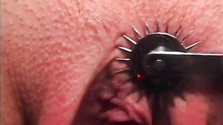 MILF dominatrix teases her blonde female sex slave with pussy clips