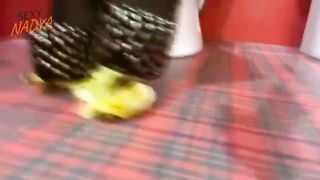 Сrashing banana with high heels