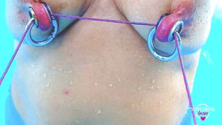 nippleringlover horny milf self nipple bondage in pool pierced nipples bound with string pulled hard