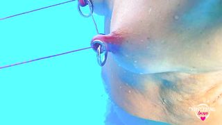 nippleringlover horny milf self nipple bondage in pool pierced nipples bound with string pulled hard