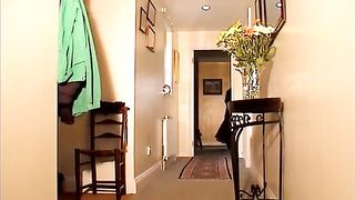 Lady Sonia in full length leather coat whips submissive man.