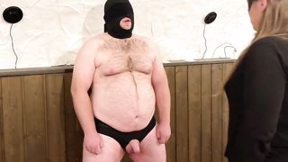 Female Domination. Ballbusting while he stands and endures submissively