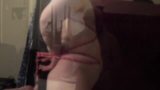 ftm Femboy balancing bare cunt on bedframe with a fuck machine in the mouth