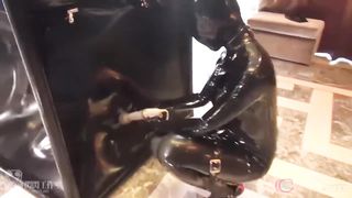 Girl Bound in Latex Vac Cube and Vibbed